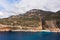 Aerial view of a beautiful bay with a beach and turquoise sea among big mountains. Kaputas beach, Kas, Türkiye.