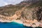 Aerial view of a beautiful bay with a beach and turquoise sea among big mountains. Kaputas beach, Kas, Türkiye.