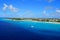 The aerial view of the beautiful blue ocean, boats, pier and white sandy beaches near Grand Turk, Turks & Caicos