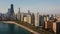 Aerial view of the beautiful Chicago cityscape. Drone t flying away from skyscrapers and Michigan lake, acceleration.