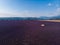 aerial view of beautiful cultivated lavender field farm and mountains in distance