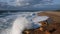 Aerial view on a beautiful deserted beach in the small tourist town of Nazare, Portugal. Huge waves of the Atlantic