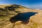 Aerial view of a beautiful glacially formed lake in a rural setting Llyn y Fan Fawr