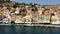 Aerial view of the beautiful greek island of Symi (Simi) with colourful houses and small boats. Greece, Symi island, view of the