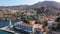 Aerial view of the beautiful greek island of Symi Simi with colourful houses and small boats. Greece, Symi island, view of the