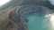 Aerial view of beautiful Ijen volcano with acid lake and sulfur gas going from crater