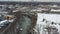 Aerial view of beautiful lake surrounded by snow covered winter landscape