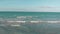 Aerial view of a beautiful Mexican beach from the sea DRONE pan left