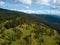 Aerial view on beautiful mountain scenario with lush forests along the Meraner Hoehenweg near Meran in South Tyrol