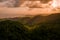 Aerial view of a beautiful mountainous forest at sunset