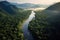 Aerial view of Beautiful natural scenery of river in southeast Asia tropical green forest with mountains in background