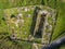 Aerial view of a beautiful old ruins of an Irish church and graveyard