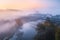 Aerial view of beautiful railroad bridge and river in fog in fall