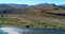 Aerial view of a beautiful river in the middle of the Argentine Patagonian desert on a sunny day