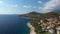 Aerial view of beautiful rocky island with modern cottage villas with sea view