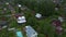 Aerial view of a beautiful Russian village on a cloudy summer day. Wooden houses. Country life.