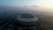 Aerial view of the Beautiful scenery Gelora Bandung Lautan Api GBLA Football or Soccer Stadium in the Morning with Blue Sky.