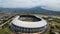 Aerial view of the Beautiful scenery Gelora Bandung Lautan Api GBLA Football or Soccer Stadium in the Morning with Blue Sky.