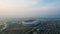 Aerial view of the Beautiful scenery Gelora Bandung Lautan Api GBLA Football or Soccer Stadium in the Morning with noise cloud.