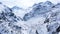 Aerial view of beautiful snowy Alps in early spring from the cable car at Zematt Village