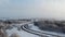 aerial view of beautiful snowy winter landscape with road in Estonia