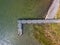 Aerial view of beautiful stone pier in Furnas lagoon, Azores islands. Drone landscape view with lines and textures. Top view of  r