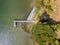 Aerial view of beautiful stone pier in Furnas lagoon, Azores islands. Drone landscape view with lines and textures. Top view of  r