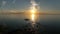 Aerial view of a beautiful sunrise or sunset behind the dome and the light of the lighthouse of the Gulf of Finland or