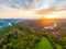 Aerial view of beautiful sunset over the Karlstejn castle, Czech Republic. Drone shot of ancient castle with near forest. Castle