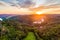 Aerial view of beautiful sunset over the Karlstejn castle, Czech Republic. Drone shot of ancient castle with near forest. Castle