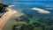 Aerial view of a beautiful tropical beach protected by a fringing tropical coral reef (Sanur, Bali