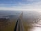 Aerial view of beautiful Vasco da Gama bridge`s suspended highway road crossing the Tagus river, one of the world`s longest brid