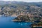 aerial view of beautiful village and calm sea with harbour and yachts in Calanques de Marseille