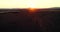 Aerial view of beautiful wild horses running in the field at sunrise