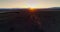 Aerial view of beautiful wild horses running in the field at sunrise, video