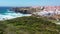 Aerial view of beautiful Zambujeira do Mar built on cliffs by Atlantic Ocean, Portugal