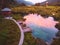 Aerial view of beautiful Zelenci lake in the Julia Alps in Triglav National Park near Kranjska Gora at sunset