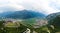 Aerial view of Beseno Castle and northern vineyards, the largest fortified structure in Besenello, Trento, Italy. wide panorama