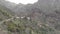 Aerial view. Big mountains hang over a small village, palm trees and a tropical climate. Masca, Tenerife, Spain