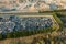 Aerial view of big parking lot of junkyard with rows of discarded broken cars. Recycling of old vehicles