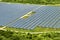 Aerial view of big sustainable electric power plant with many rows of solar photovoltaic panels for producing clean