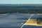 Aerial view of big sustainable electric power plant with many rows of solar photovoltaic panels for producing clean