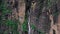 Aerial view of a big waterfall with clean water flowing down during monsoon at Jogini Waterfalls , Manali , Himachal