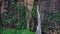 Aerial view of a big waterfall with clean water flowing down during monsoon at Jogini Waterfalls , Manali , Himachal