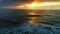 Aerial view on big waves and dramatic sunset sky