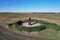 Aerial view of the biggest petrified shepherd Menhir stone standing in a field in the Czech republic