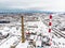 Aerial view of biofuel boiler-house plant facilities with steaming chimneys on winter day in Klaipeda, Lithuania