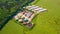 Aerial view of biogas plant near farm in countryside