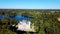 Aerial View of the Birinu Palace. Latvian Castle by Lake With Nice Garden, Drone Shot. Birini Manor, Vidzeme Region, Latvia