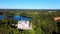 Aerial View of the Birinu Palace. Latvian Castle by Lake With Nice Garden, Drone Shot. Birini Manor, Vidzeme Region, Latvia